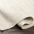 Alfombra trenzada de yute sintético de color beige