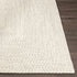 Alfombra trenzada de yute sintético de color beige