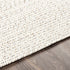 Alfombra trenzada de yute sintético de color beige