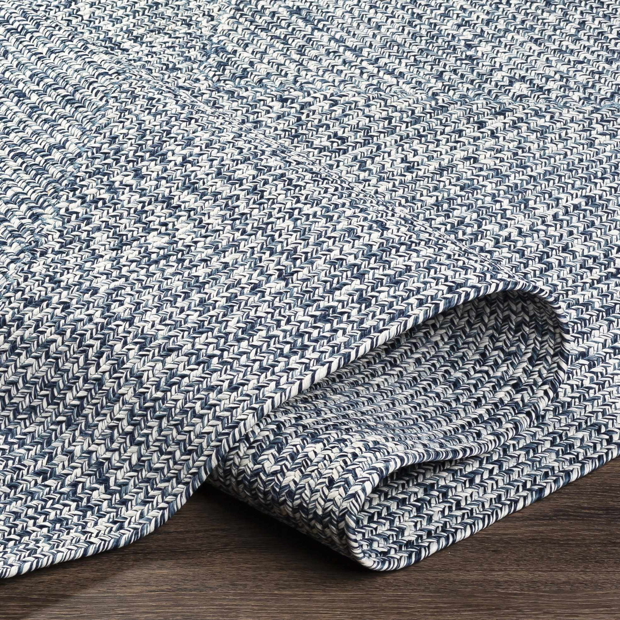Alfombra trenzada de yute sintético de color azul
