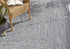 Alfombra trenzada de yute sintético de color azul