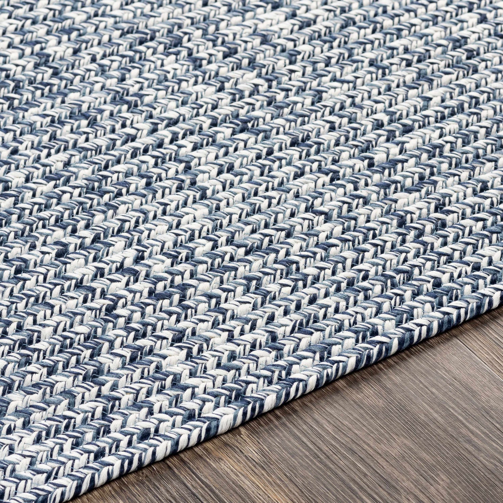 Alfombra trenzada de yute sintético de color azul