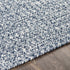 Alfombra trenzada de yute sintético de color azul