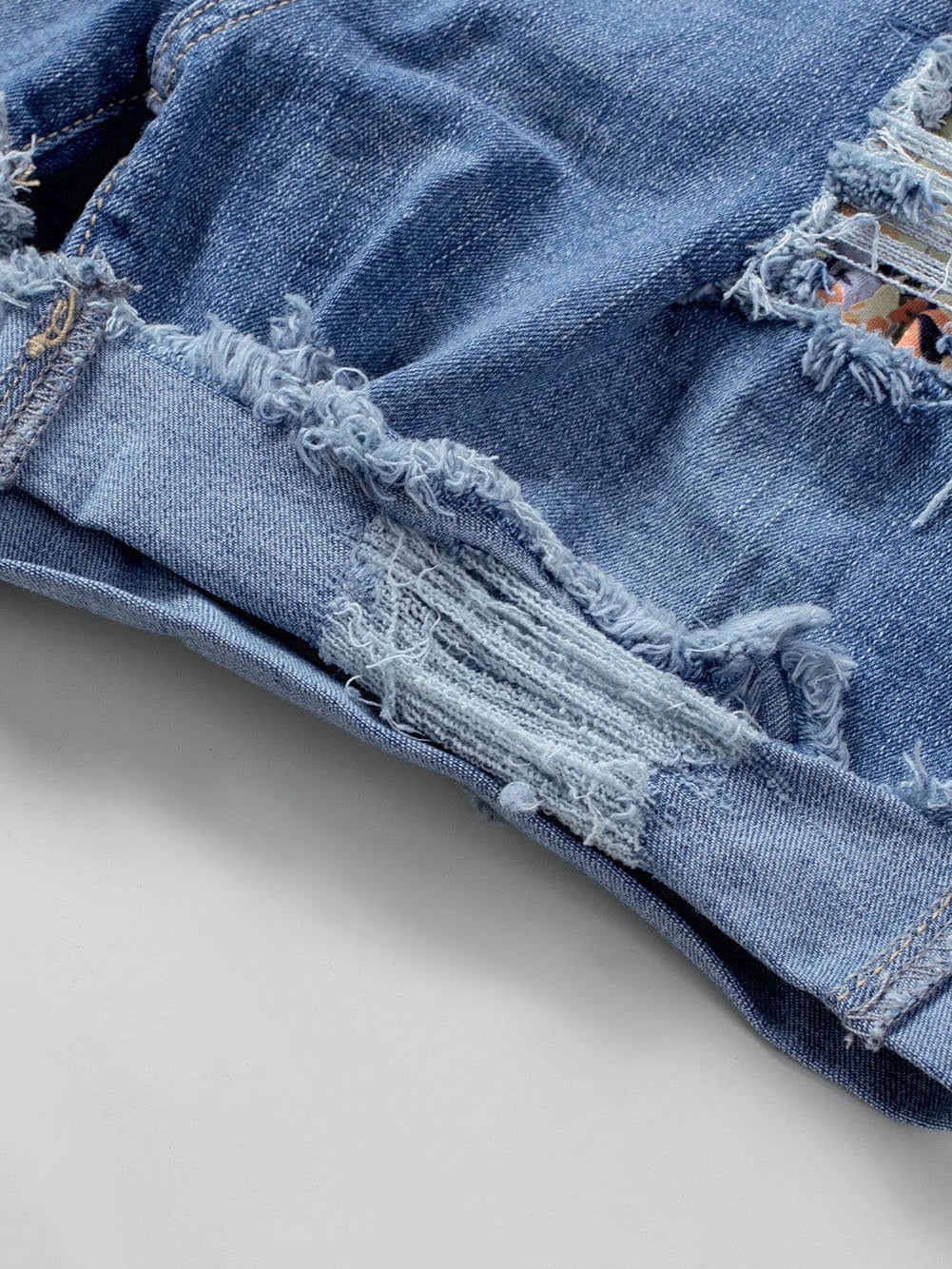 Trendy Ripped Denim Shorts with Unique Floral Design
