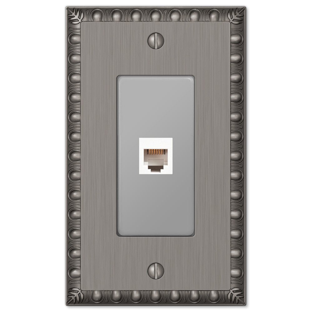 Placa de pared con toma de teléfono de níquel antiguo fundido con forma de huevo y dardo
