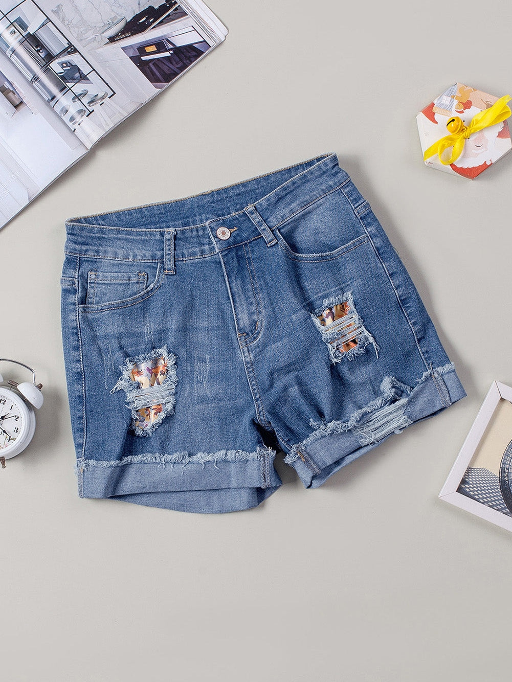 Trendy Ripped Denim Shorts with Unique Floral Design