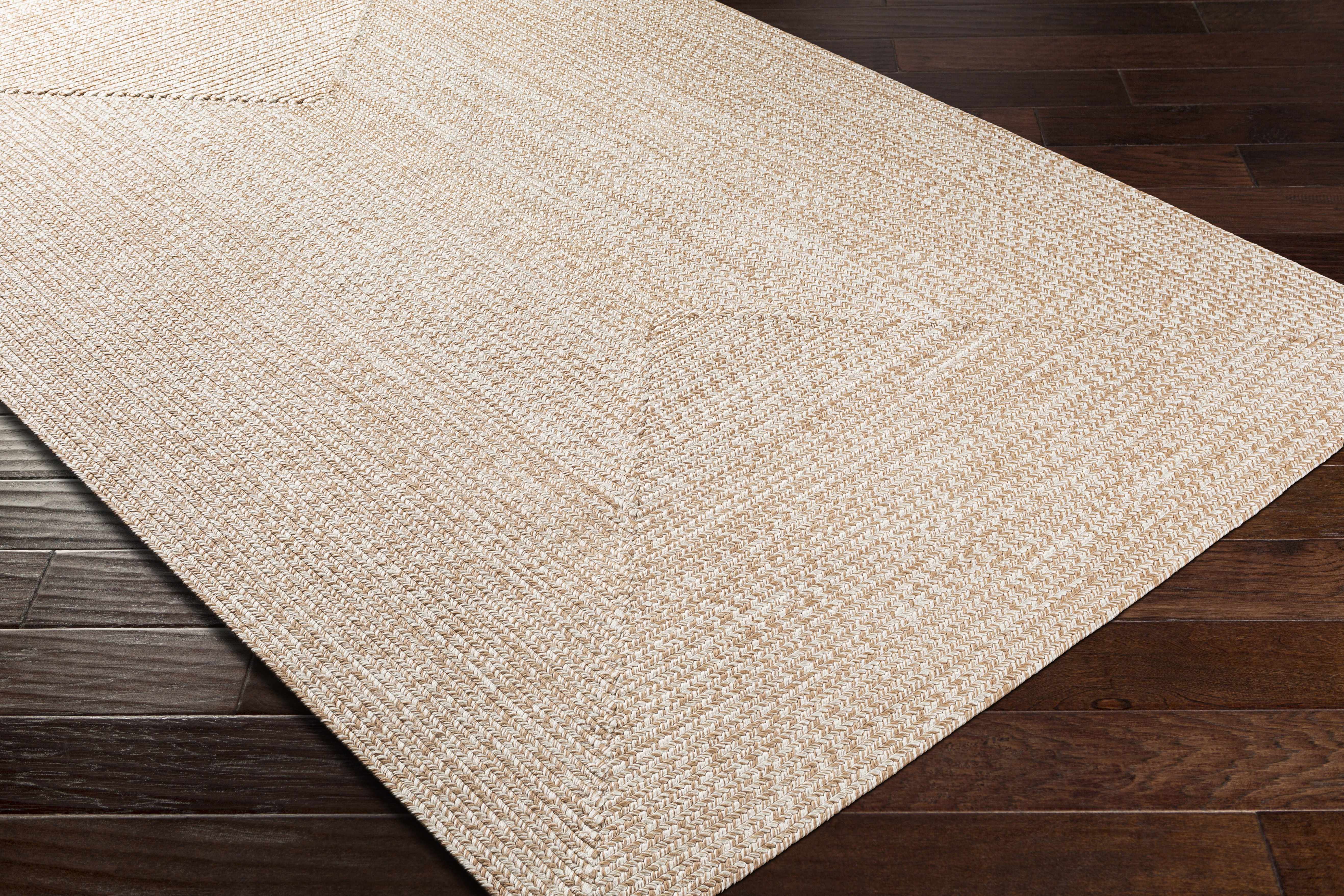 Alfombra trenzada de yute sintético de color crema