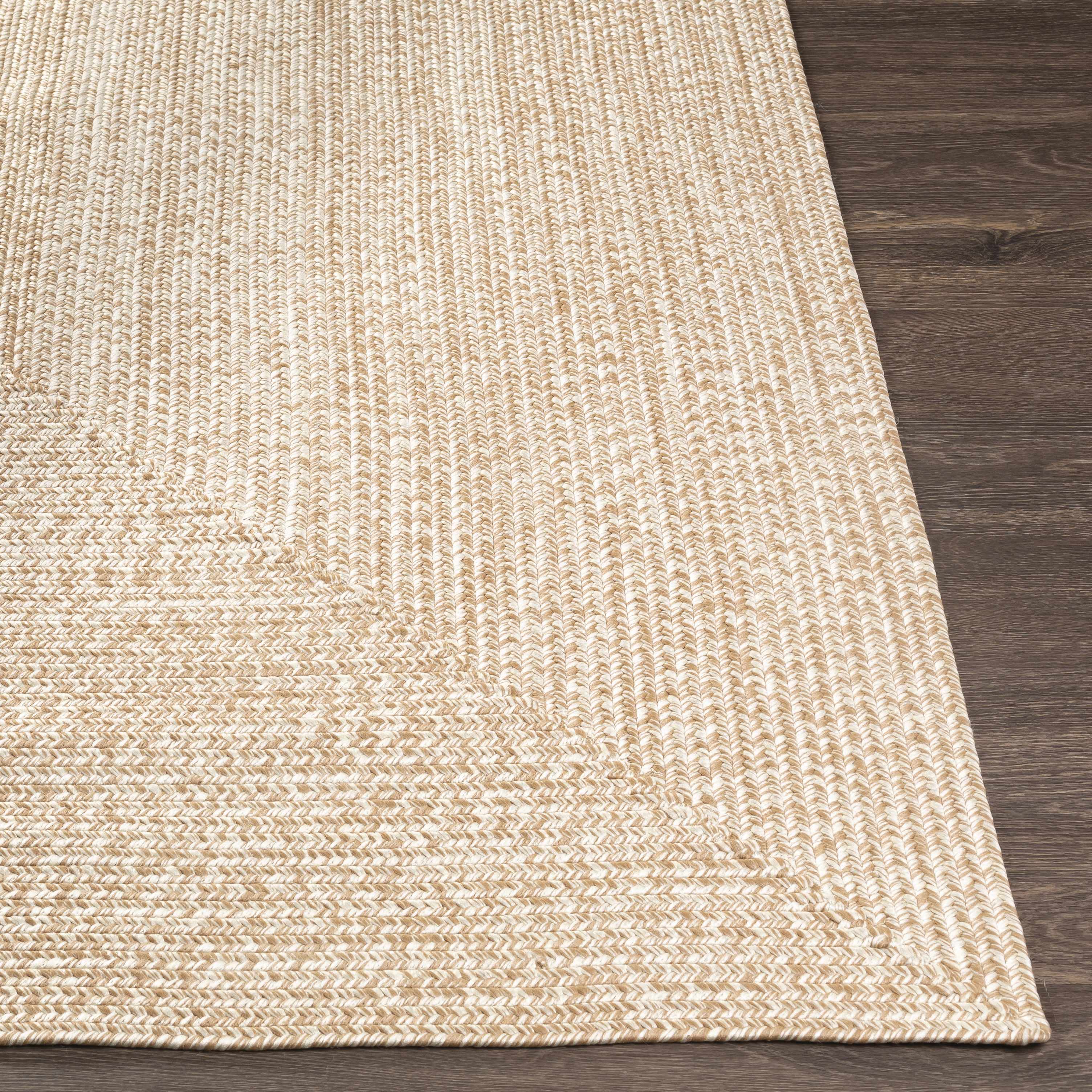 Alfombra trenzada de yute sintético de color crema
