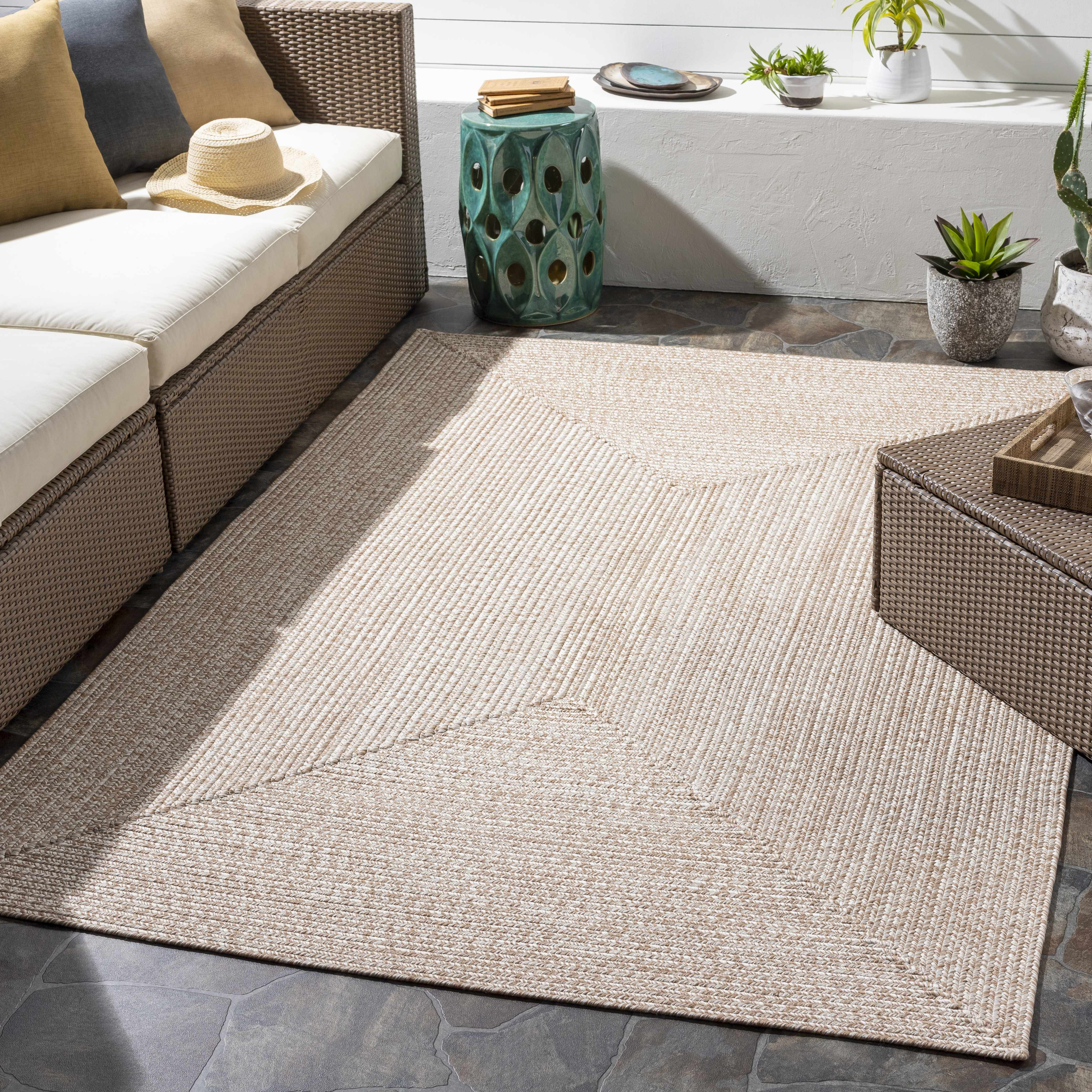 Alfombra trenzada de yute sintético de color crema