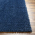 Alfombra peluda Faina de color azul oscuro liso lavable