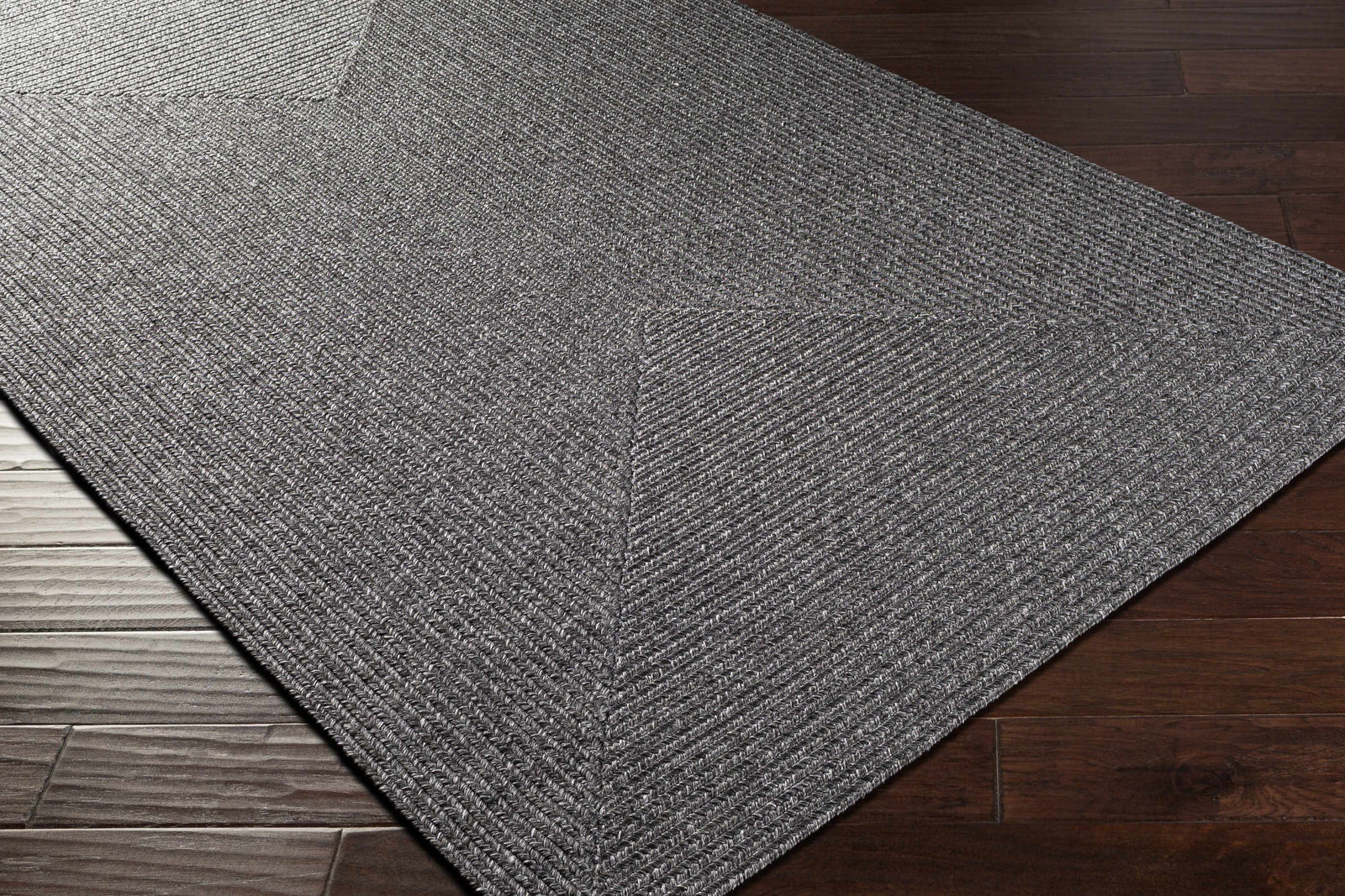 Alfombra trenzada de yute sintético de color negro