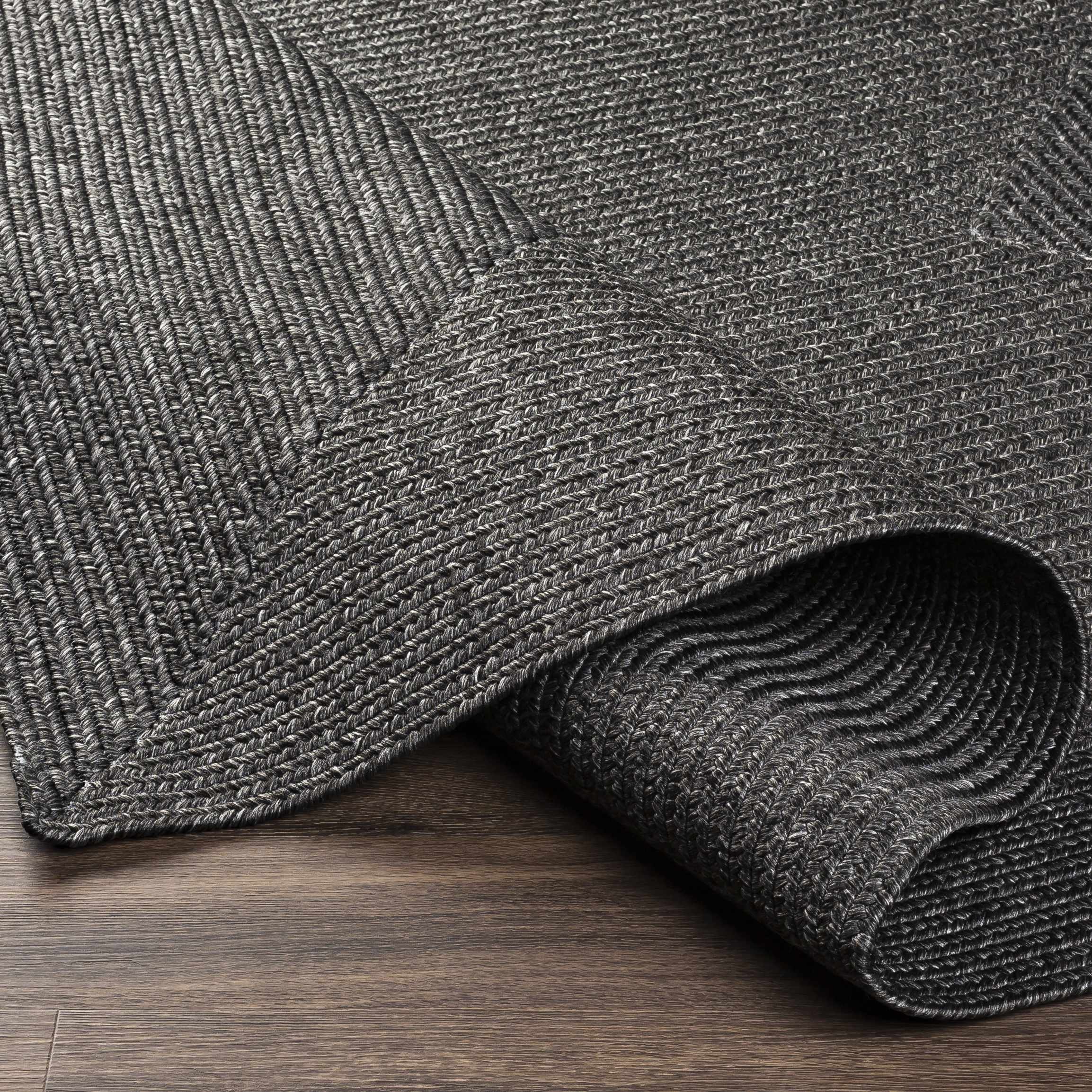 Alfombra trenzada de yute sintético de color negro