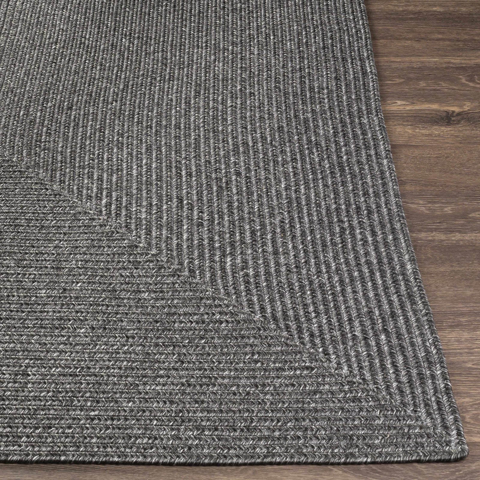 Alfombra trenzada de yute sintético de color negro