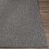 Alfombra trenzada de yute sintético de color negro