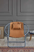Silla plegable de piel sintética con estructura de metal color naranja