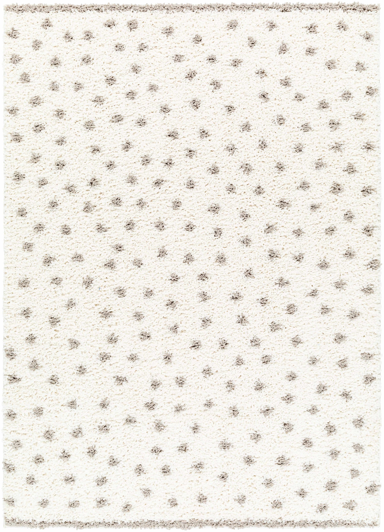 Alfombra de felpa con lunares color crema y gris de Chaia