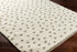 Alfombra de felpa con lunares color crema y gris de Chaia