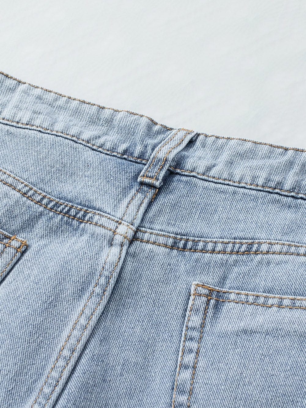 Stylish Ripped Denim Shorts with Tassels
