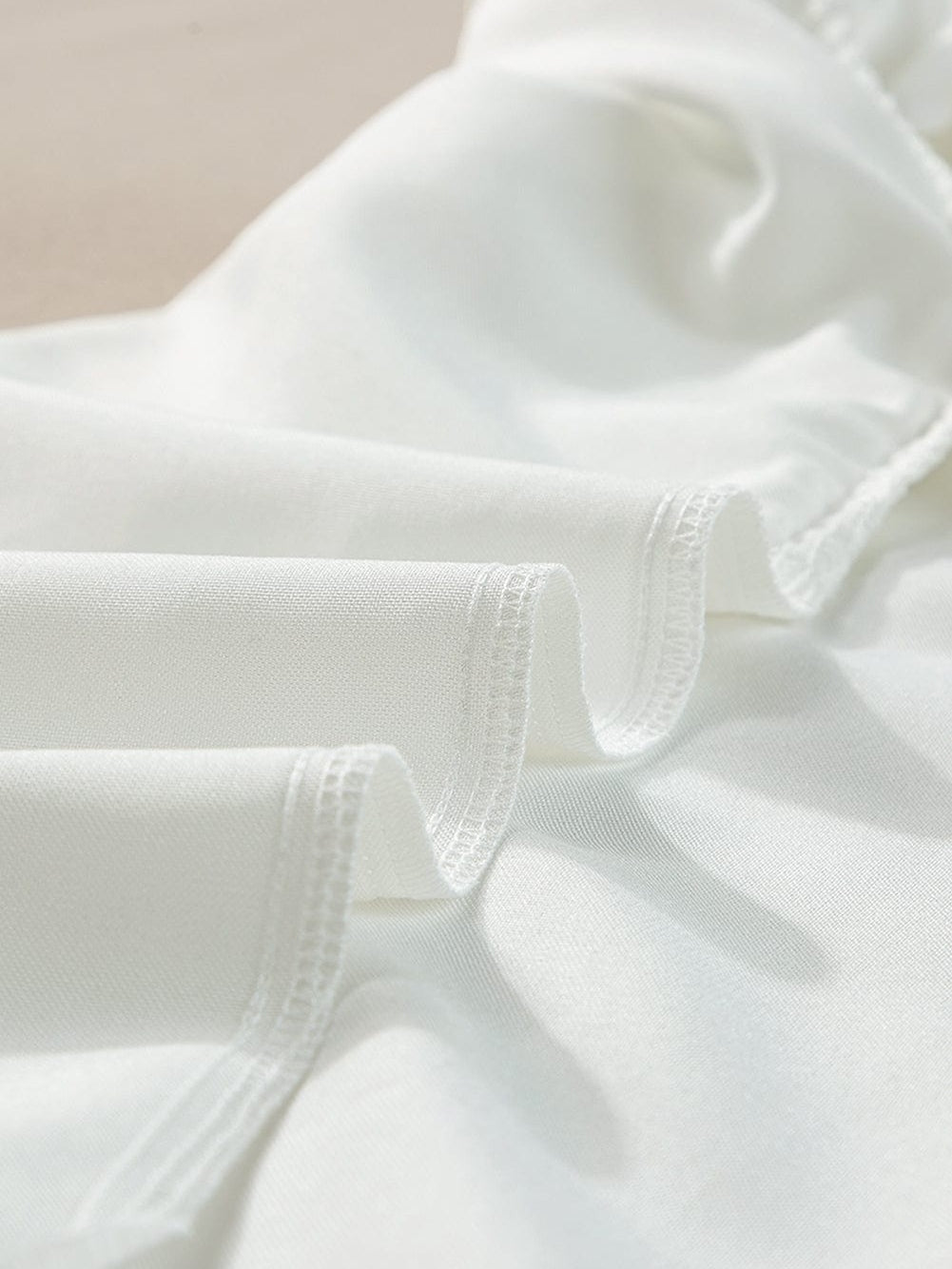 Modern White Ruffle Top